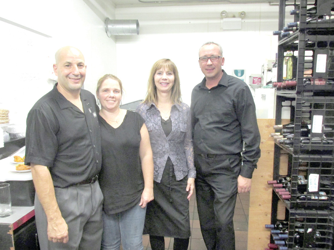 TERRIFIC TEAM: The Ave Restaurant Bar & Grill owners David and Jennifer Lombardo (left) are joined by Hostess Carol Boucher and Manager Mike Jodoin during last Friday night’s official Grand Opening at 1428 Hartford Avenue.
